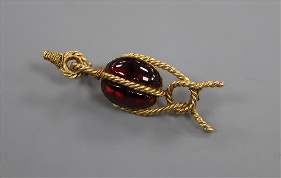 A late Victorian ropetwist yellow metal and cabochon garnet set brooch (a.f. pin broken),